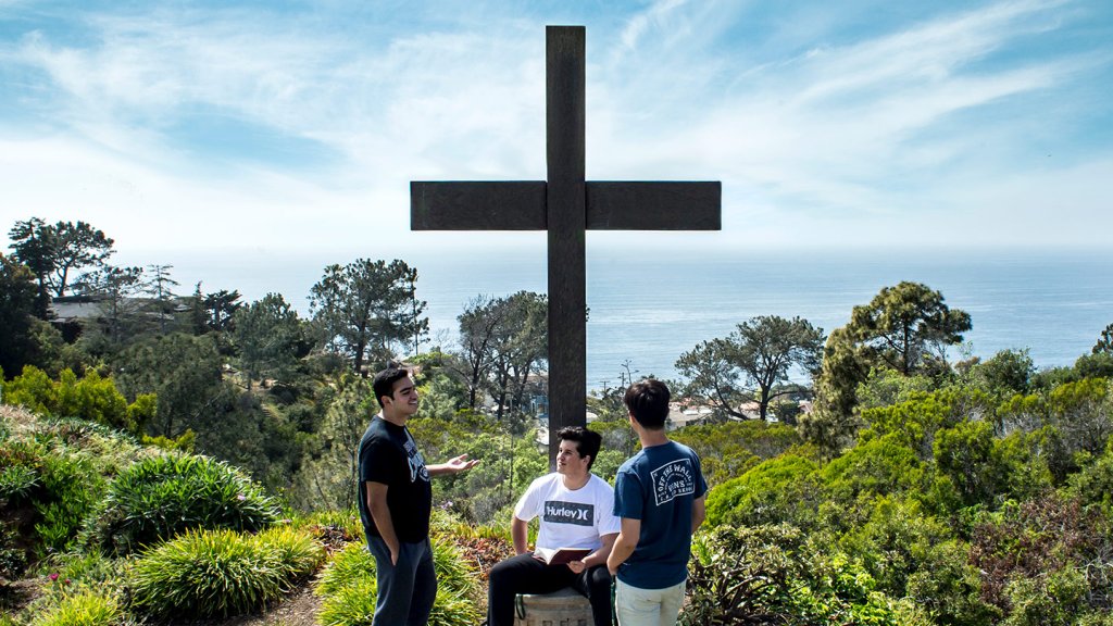 students by the cross
