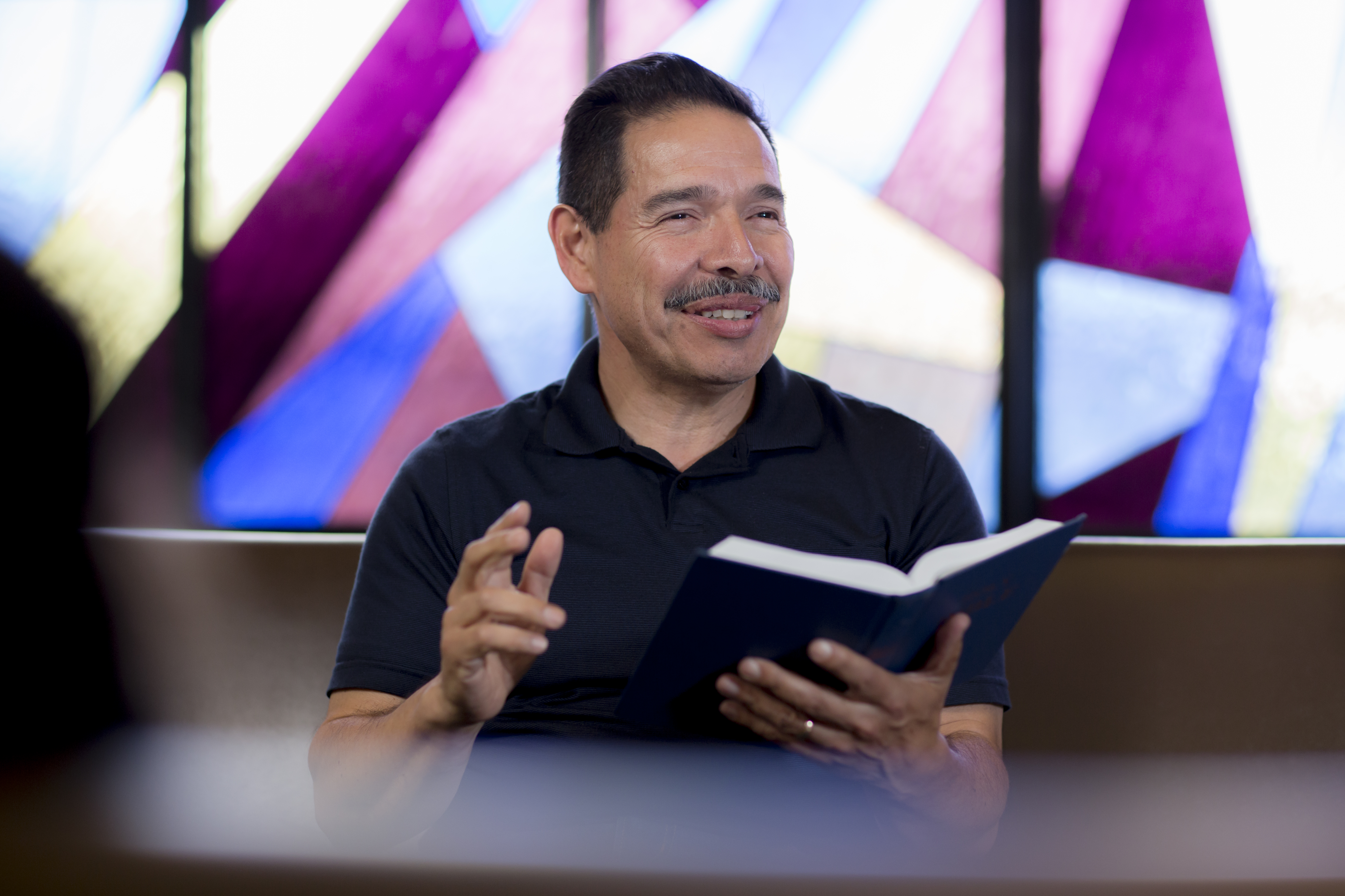 Professor teaches from the bible in Smee Hall.