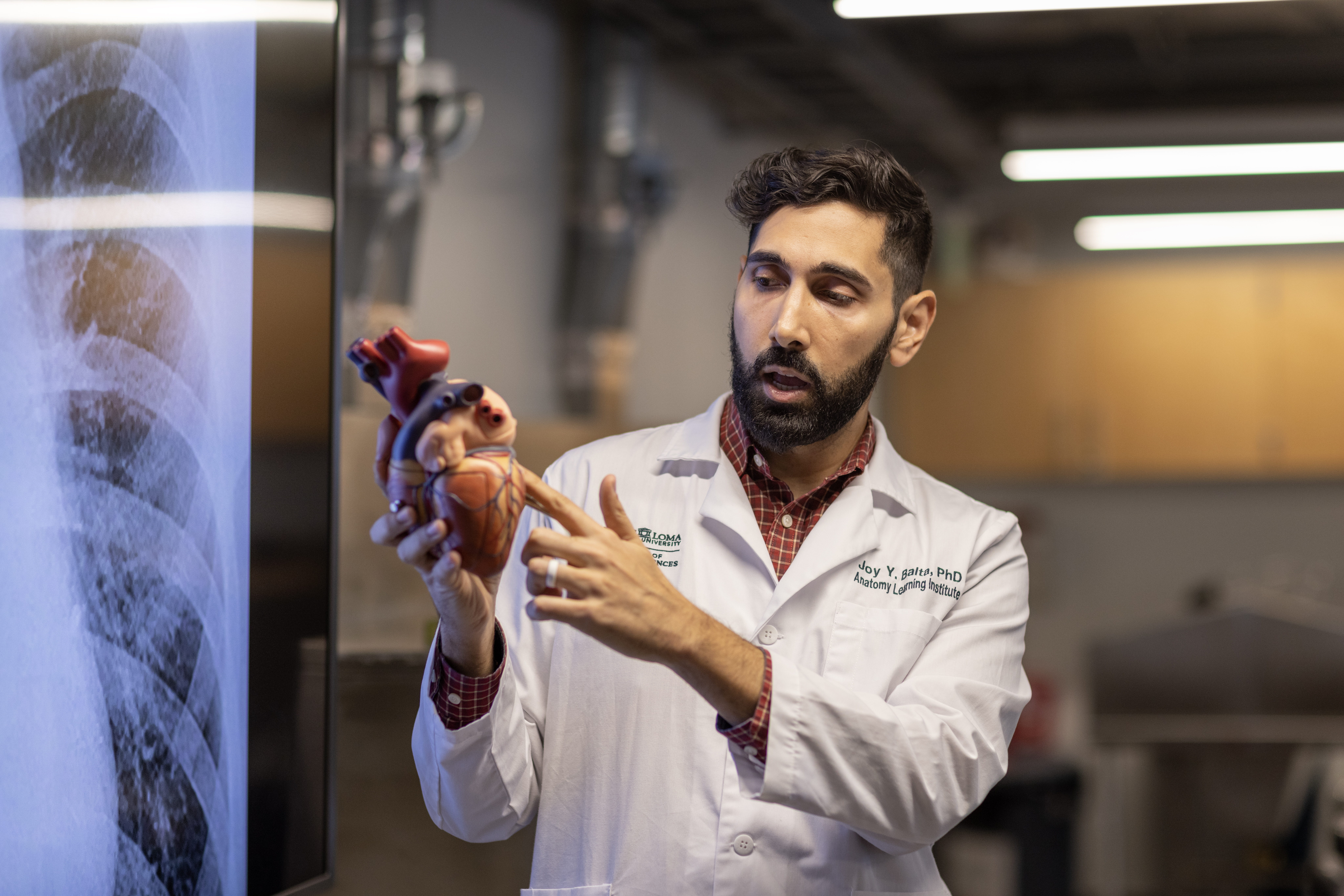 Associate Professor and Director Joy Y. Balta, PhD. gives anatomy lecture to students in laboratory.