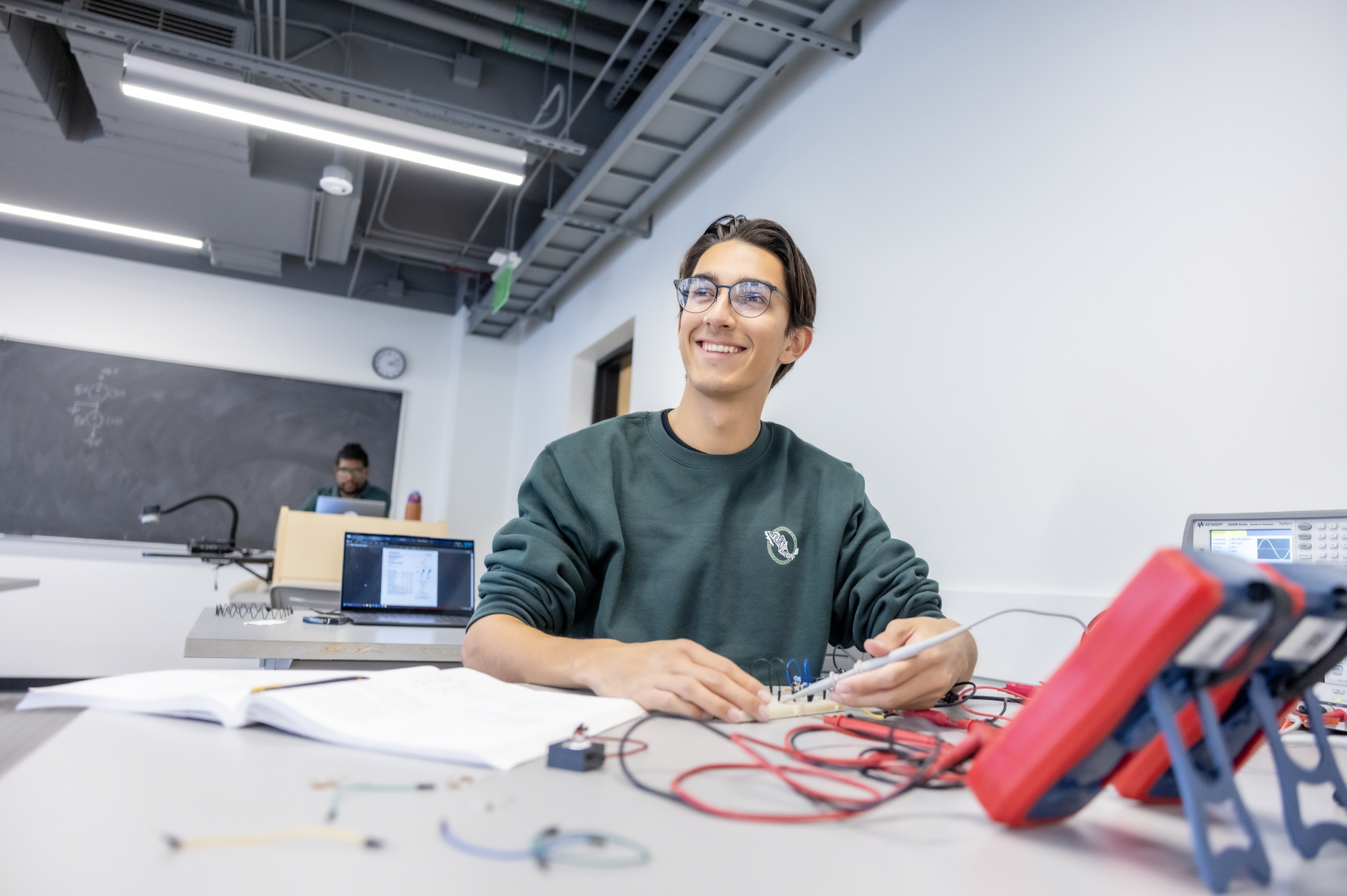 PLNU student works on technical project in the engineering lab.