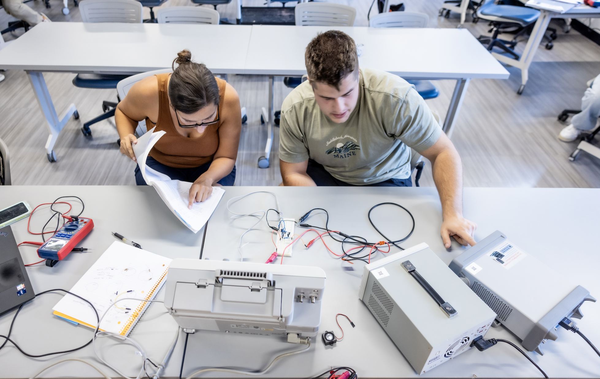 PLNU students work together on technical project in the engineering lab on the university campus.