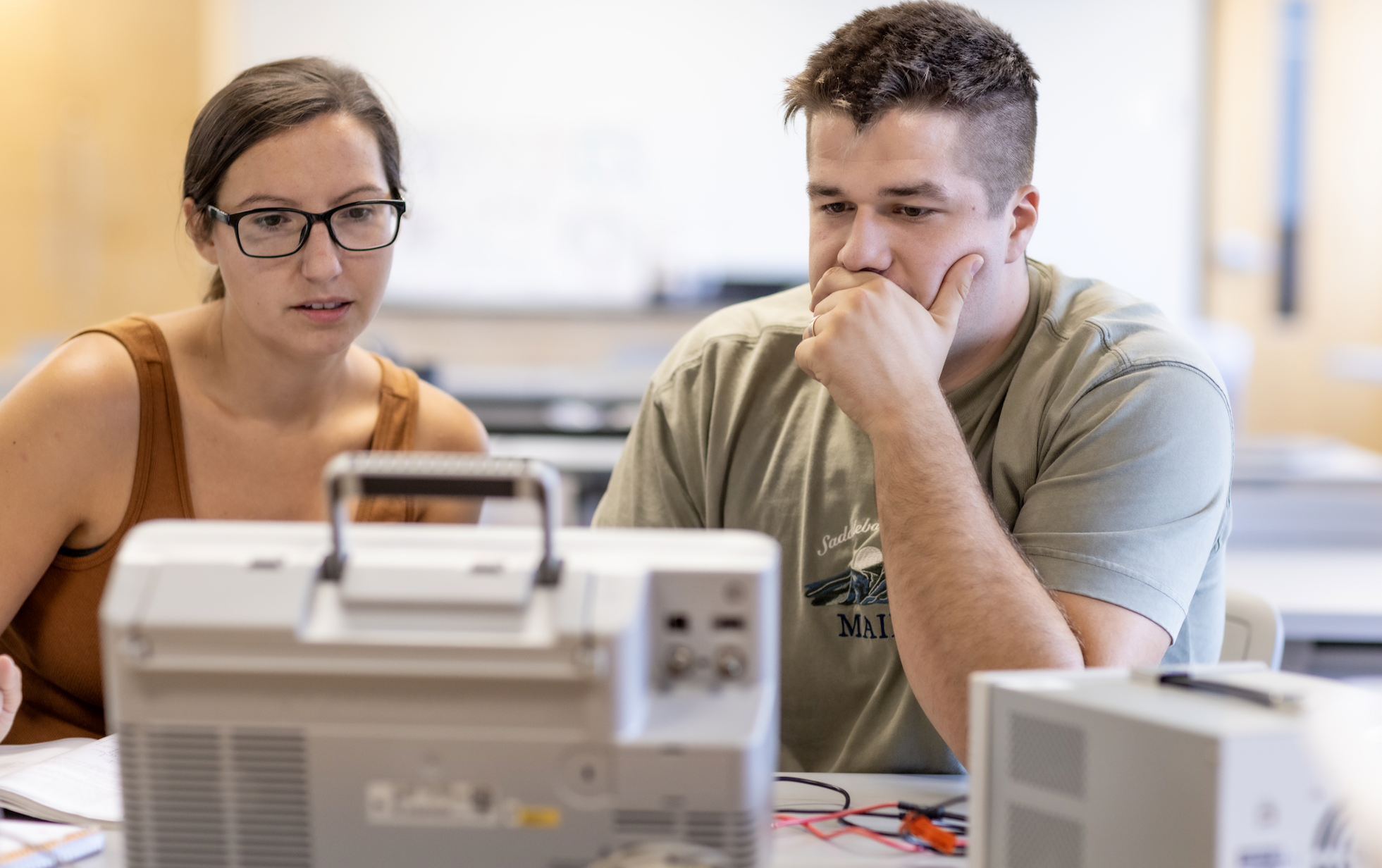 PLNU students work together on technical project in the engineering lab on the university campus.