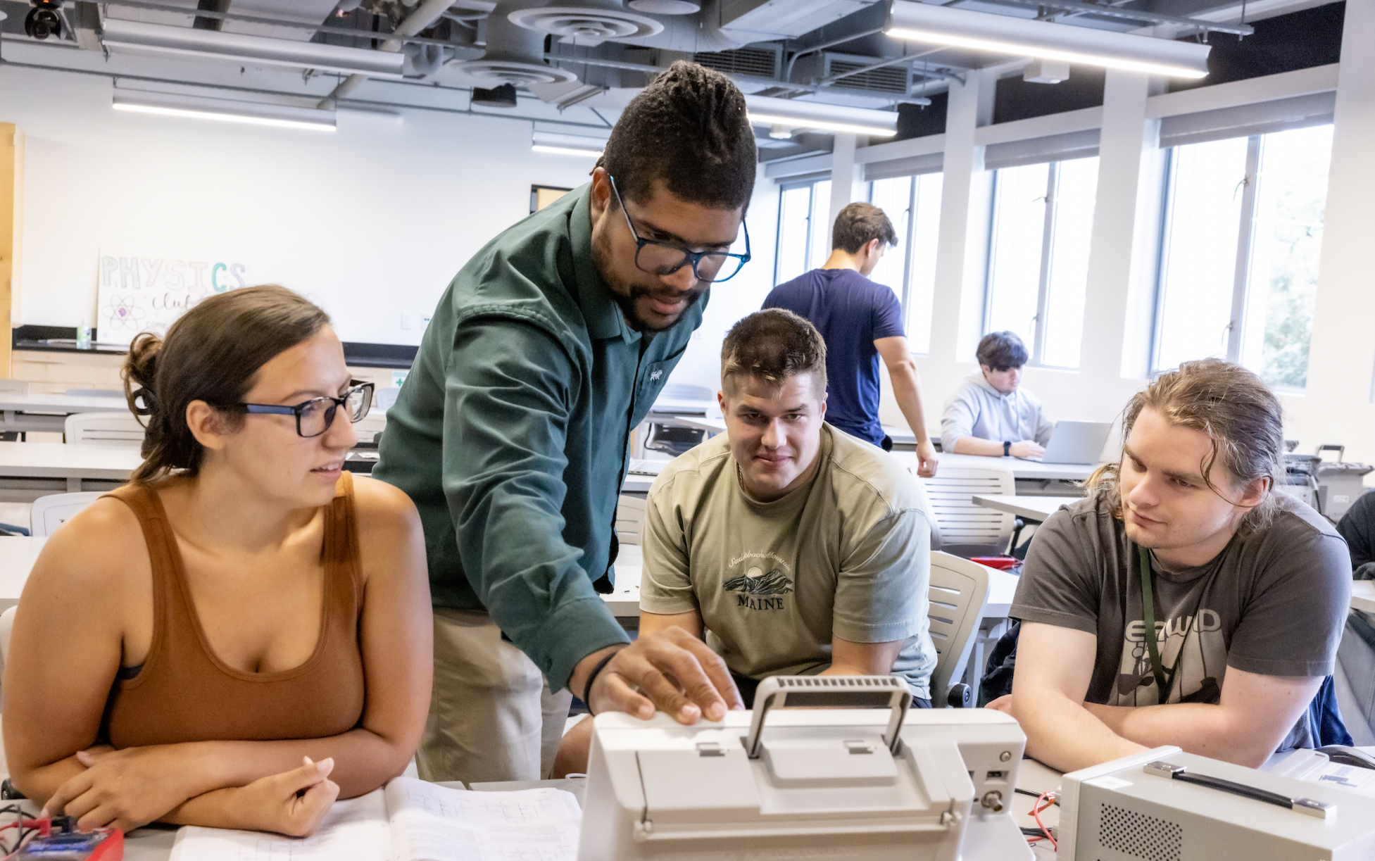 PLNU students work together on technical project in the engineering lab on the university campus.