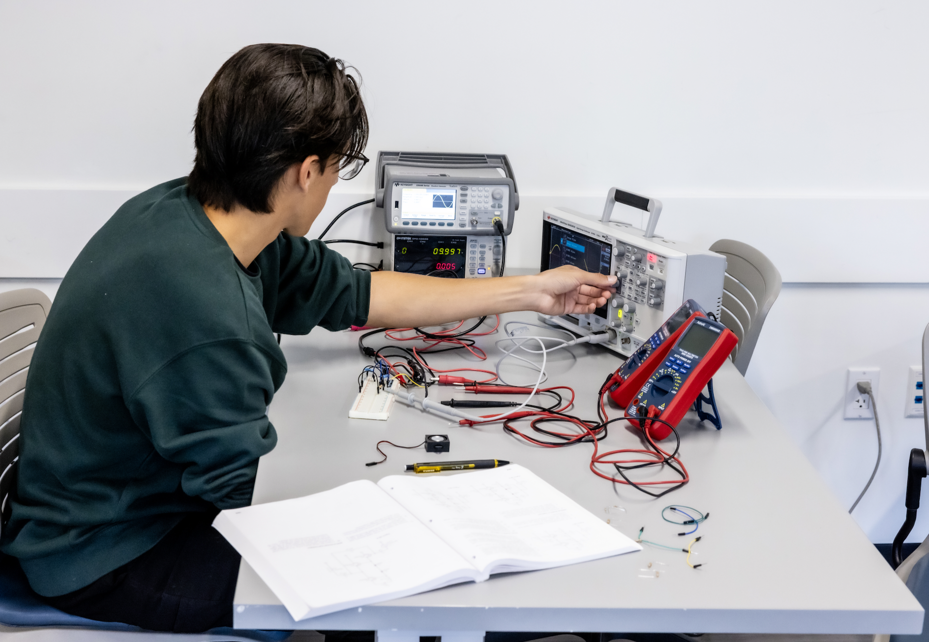 PLNU student works on technical project in the engineering lab.