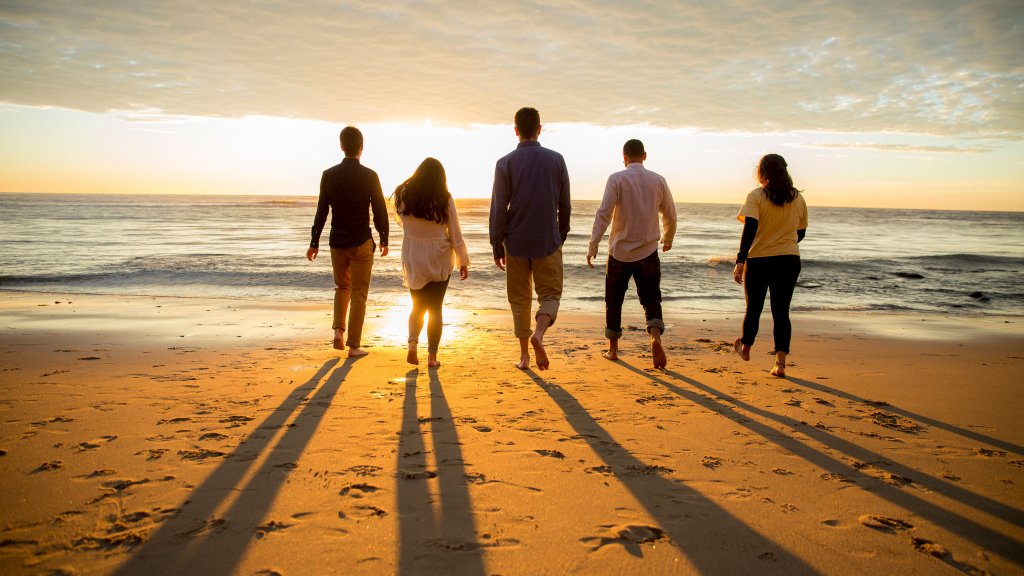 students walking into the sunset