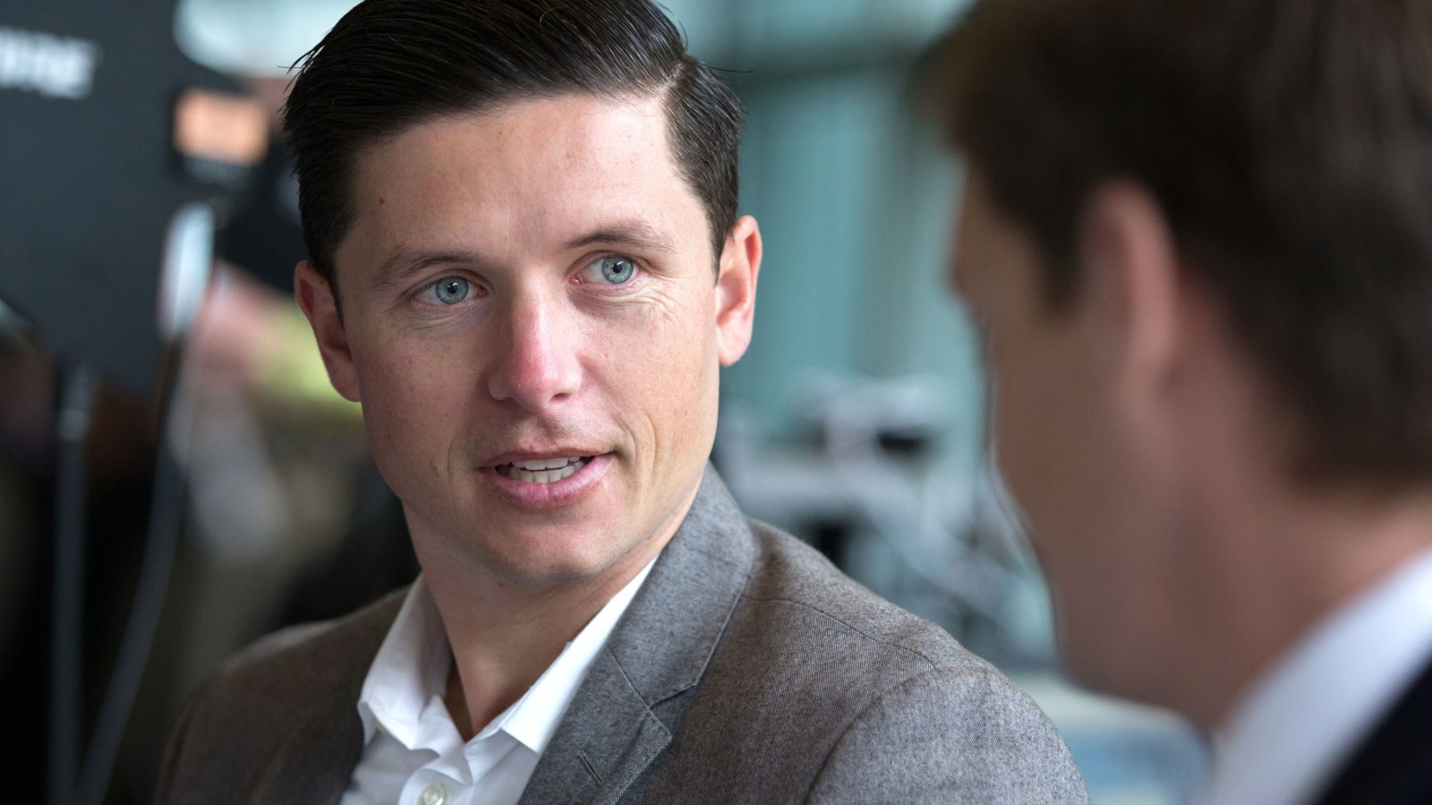 Business student engage in conversation in class