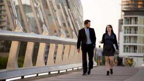 Two adults walking and talking 