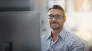 stock photo of guy at computer