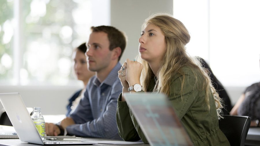 Students look intently in a classroom.