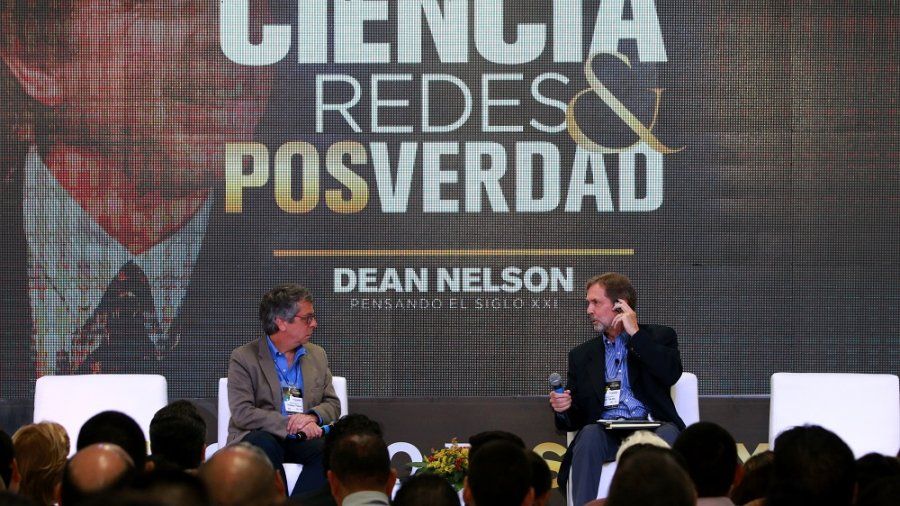Dean Nelson speaking at a conference in Columbia