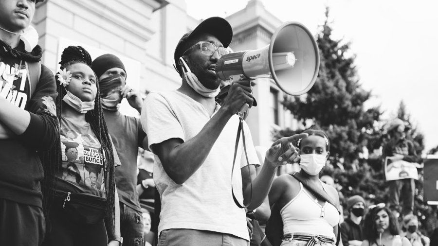 A man stands with a megaphone as part of the Black Lives Matter protests