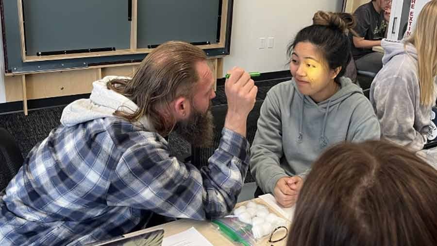 MSOT student performs an eye exam