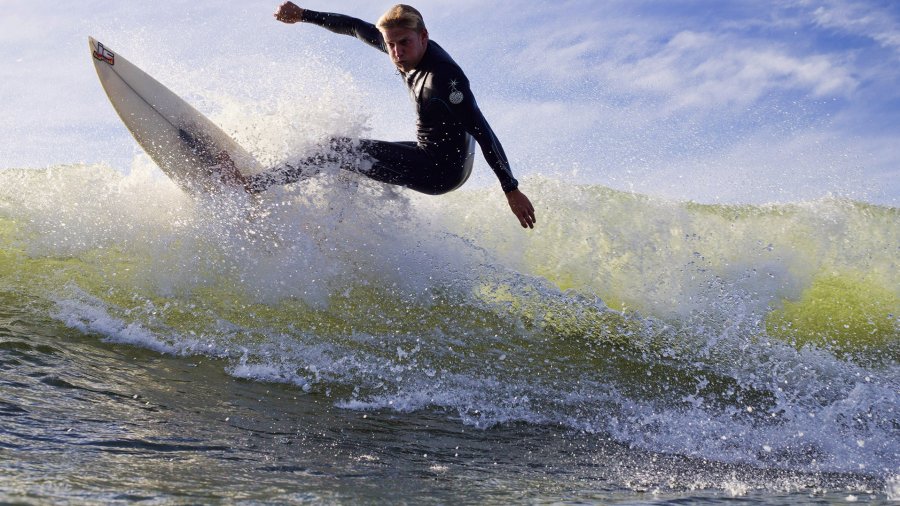 Quay Snyder (14) surfs at Sunset Cliffs as part of PLNU's Surf and Serve ministry.