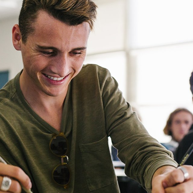 A student takes notes in class