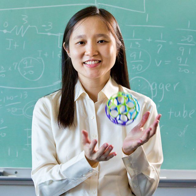 PLNU professor Michelle Chen tosses up a colorful ball while posing for a headshot