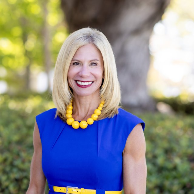 Portrait headshot of Melanie Hulbert.