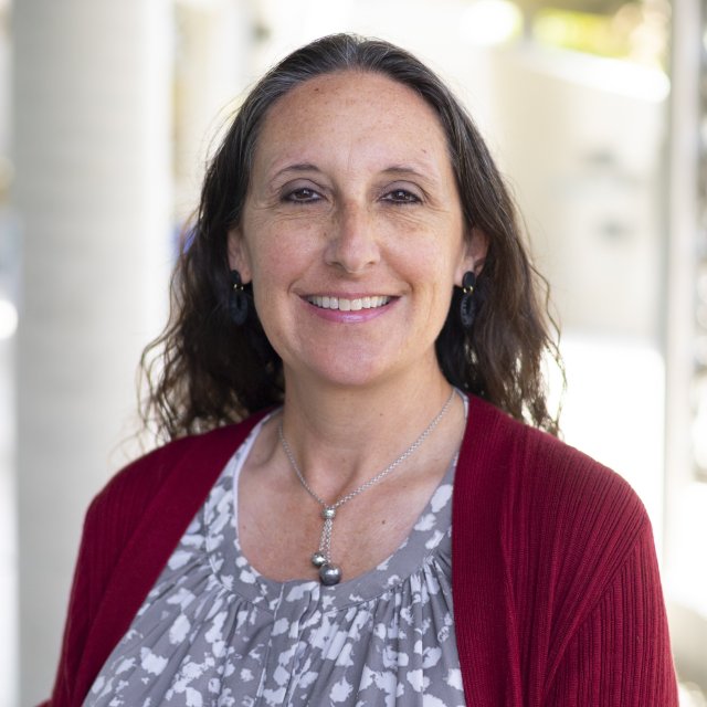 Portrait headshot of Andee Woolf.