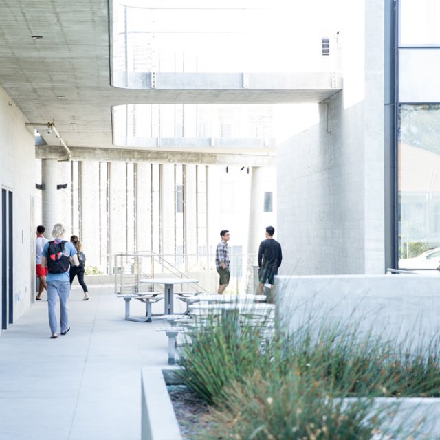 Students walk into the science building on PLNU's campus.