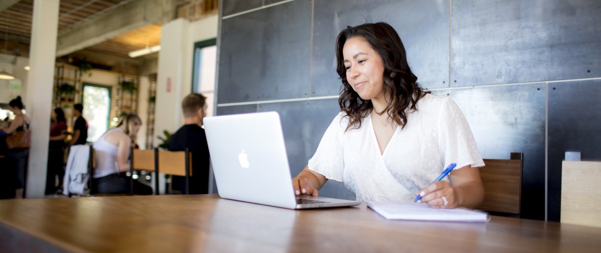 PLNU student working on computer at Moniker General.
