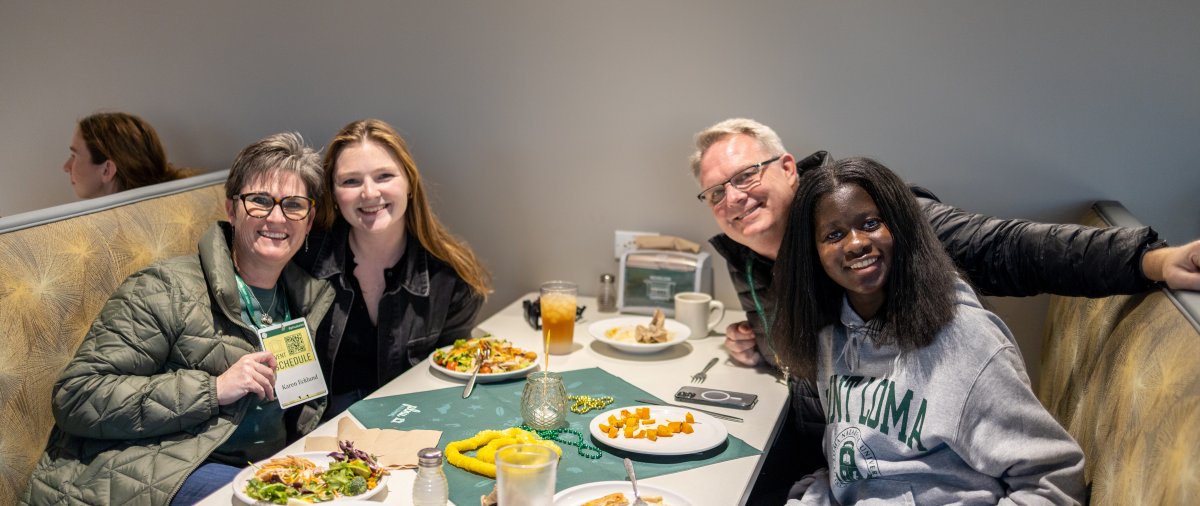 PLNU alumni sharing a meal with family on-campus