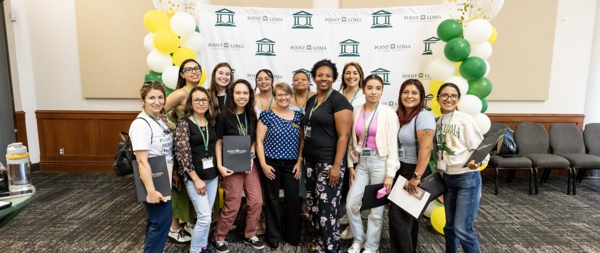GPS students pose for picture at Liberty Station event.
