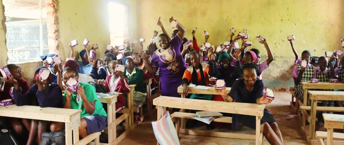 Kenyan women celebrate in a classroom