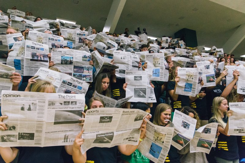 People holding newspapers