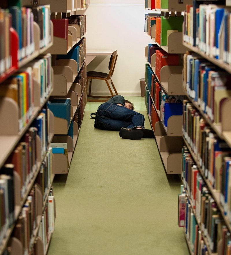 Student asleep in library