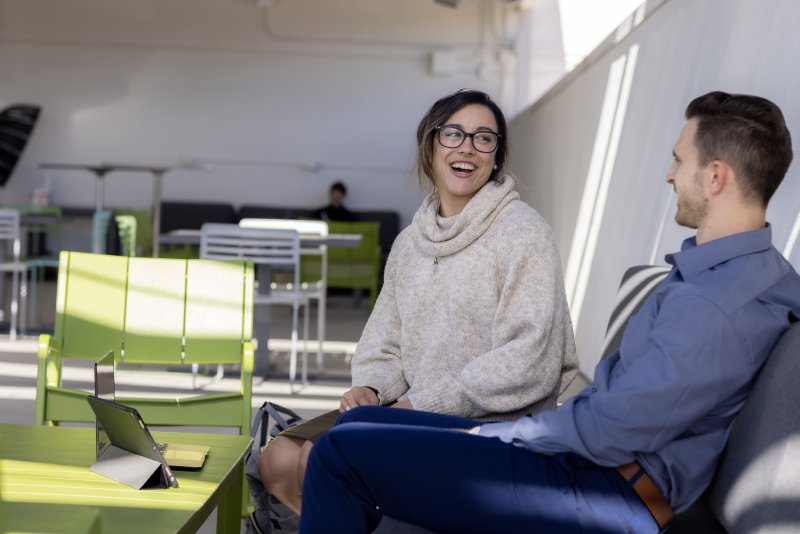 2 Students conversing outside 