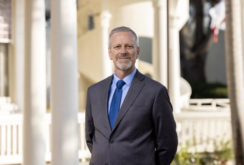 President Fulcher stands outside Mieras Hall