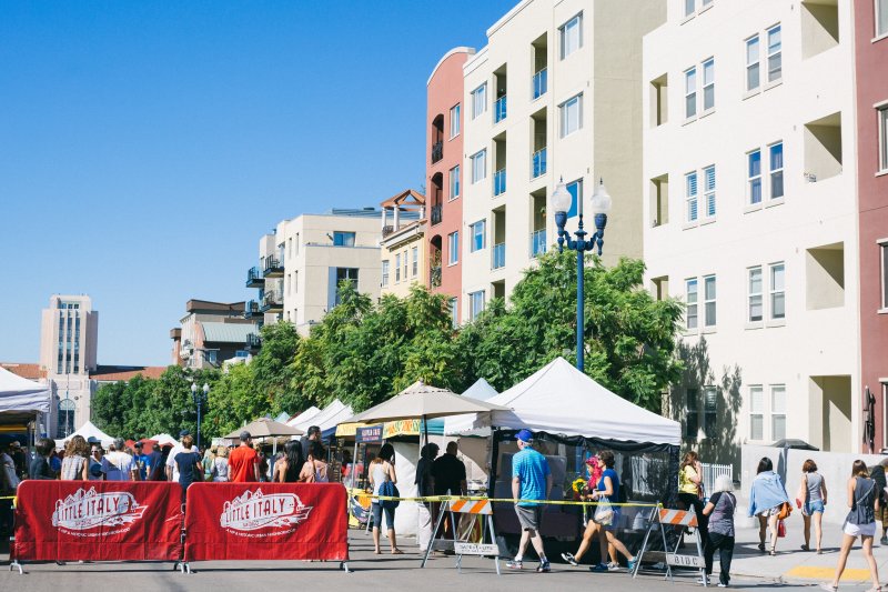 People attend the Little Italy farmer's market in San Diego