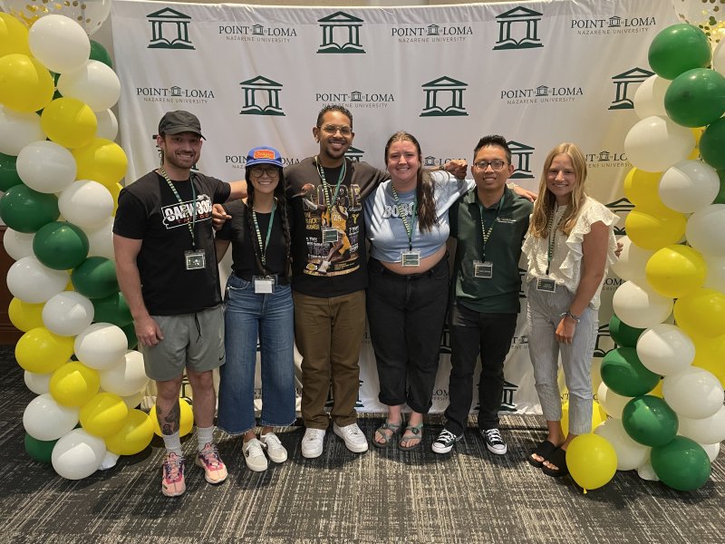 Students in front of a PLNU banner at MSOT orientation 