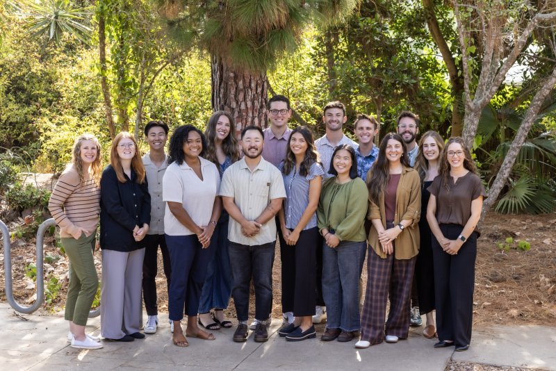 Residential Life team photo together in forest setting.
