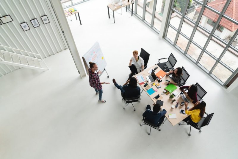 Overhead view of a casual business meeting in an open office