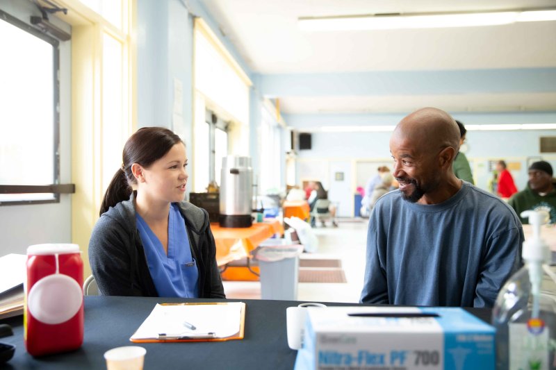 a healthcare provider talking to a patient 